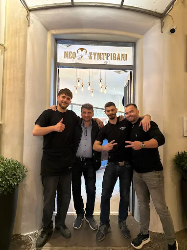 Friendly Greek hospitality and welcoming service at Sintrivani cafe and restaurant in Kos Town