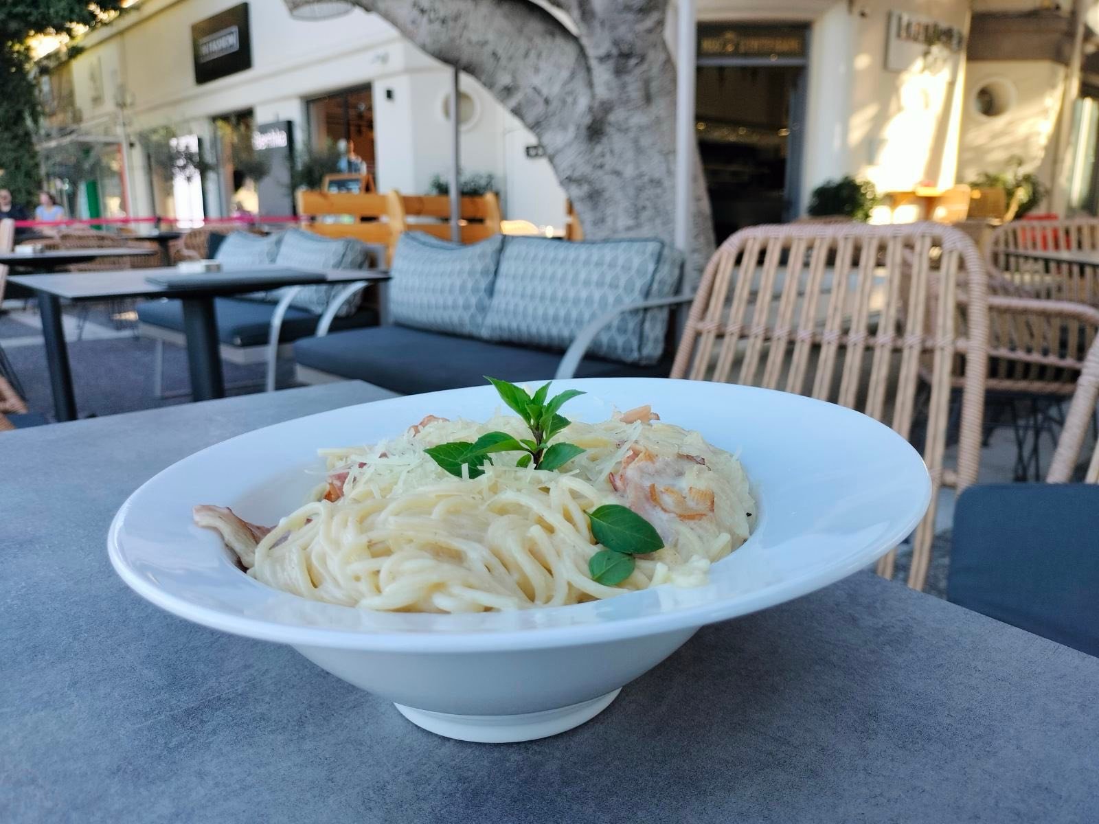 Mediterranean pasta served outdoors at Sintrivani restaurant in Kos Town
